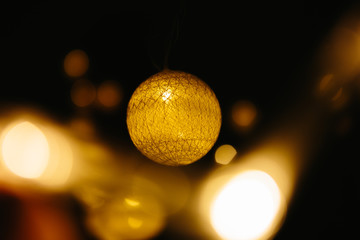 Christmas lights on dark background. Ball shaped.
