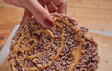 Cropped view woman hand is picked a carbohydrate snack