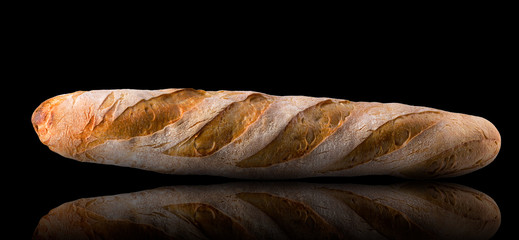 French baguette with reflection isolated on a black background