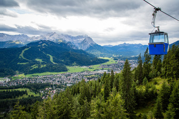 View of Garmisch-Partenkirchen in Bavaria Germany with cable car cabin and Zugspitze in the...