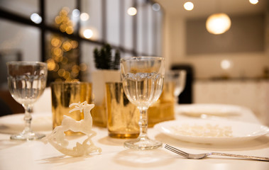 Close up photo of festive table setting in a restaurant or in a beautiful big house on some holidays.