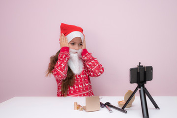 little girl blogger, influence, in a Christmas hat