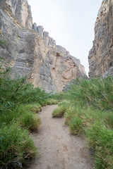 A river cuts through to form a canyon in the desert of West Texas.