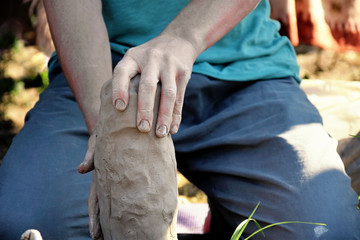 a master class in modeling clay dishes for a company of people