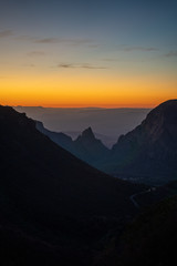The sun begins to set over the mountains of West Texas. 