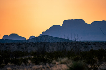 The sun begins to set over the mountains of West Texas. 