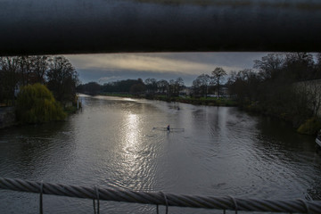 sunset on the river and floating boats