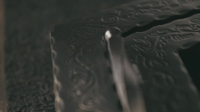 Forge workshop. Smithy manual production. Finished product - window for the fireplace with art metal carved. Pattern on iron. Carving ornament. Blacksmith makes steel products for manufacture of stove