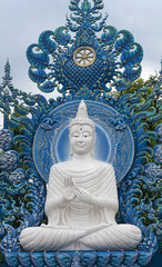 White Guan Yin goddess statue - detail of exteror of Wat Rong Suea Ten, or Blue Temple in Chiang Rai Province, Northern Thailand