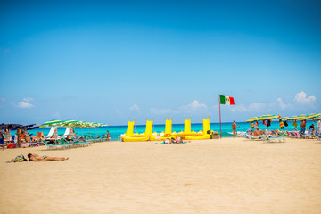 beach with umbrellas and sunbeds on beach