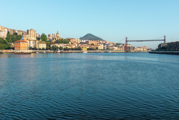 Naklejka na ściany i meble Panorama of Portugalete and Getxo with Hanging Bridge of Bizkaia from La Benedicta pier, Basque Country, Spain 