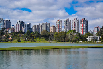Barigui Park, Curitiba, Brazil. View of several buildings. Lake.