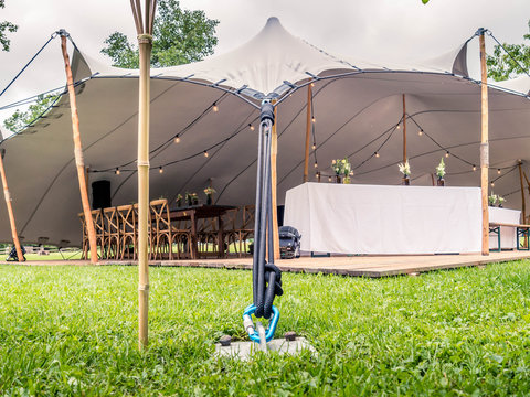 Image of huge white tent for a wedding event in the nature