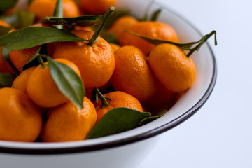 fresh tangerines in a bowl