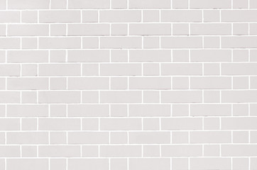 White brick wall, grey background of masonry, texture stained blocks of stonework.