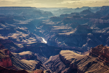 Fototapeta premium Spectacular landscape of the Grand Canyon, with the Colorado River winding on the background of its beautiful gorges, Arizona