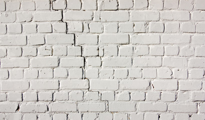 White brick wall, ackground of cracked masonry.Texture stained blocks of stonework.