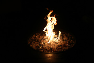 Fire in the dark inside a fire pit