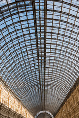 Vintage walls and openwork ceilings of the glass roof of the old building. Close up. Art of architecture.