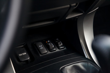 Control switch heated two front seats on the car dashboard with plastic buttons to control the temperature of the passenger compartment and comfort while driving. Auto service industry.