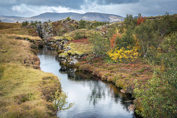 Fototapeta na wymiar Þingvellir or Thingvellir national park in Iceland, is a site of historical, cultural, and geological significance, the fissure devides the tectonic plates of America and Eurasia