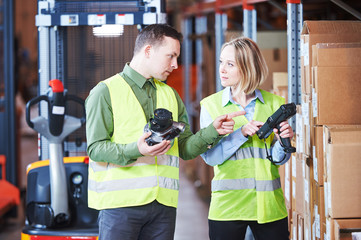 Warehouse service and Management System. Worker with barcode scanner