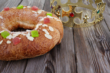 Epiphany cake, Kings cake, Roscon de reyes or Rosca de reyes on wooden table