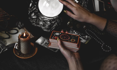 Magical scene, esoteric concept, fortune telling, tarot cards on a table 