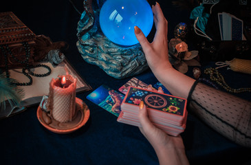 Magical scene, esoteric concept, fortune telling, tarot cards on a table 