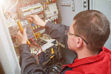 electrician measurements with multimeter tester