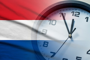Composite image of the Netherlands flag and clock