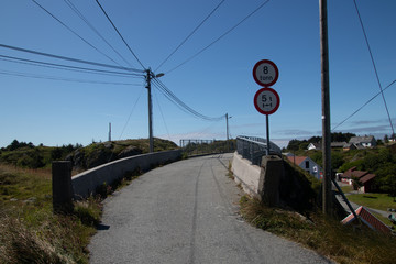 Bridge between the islands in the beautiful old fishing village Rovaer in western Norway.