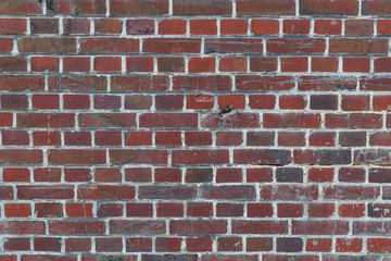 Rote Backsteinwand als Hintergrund oder Textur