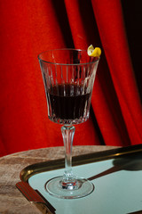 Red vermut (or vermouth), a fortified wine, garnished with lemon peel, in Venice, Italy