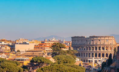 Panorama Rome Italy, sunset city Colosseum ruins Roman Forum from square of Venice