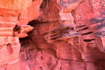 Red and Orange Sandstone Rock Formations along the Bone Wash Elephant Arch Trail in Red Cliffs National Desert Reserve in Saint George, Utah. United States.