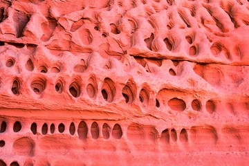 Red and Orange Sandstone Rock Formations along the Bone Wash Elephant Arch Trail in Red Cliffs National Desert Reserve in Saint George, Utah. United States.
