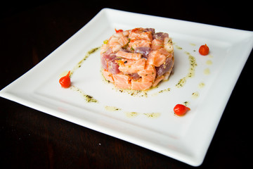 sushi hashi sauce on white plate shoyu raw salmon and sesame pepper, asian food, japanese cuisine