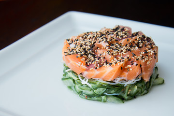 sunomonu in white dish hashi shoyo sauce raw salmon and sesame, asian food, japanese cuisine