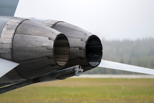 Fighter Jet Engine Nozzles. The Engines Are Off. Overcast Sky. Closeup View.