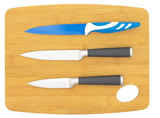 knifes on kitchen board on white