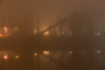 Thick Fog in the night Holesovice about River Vltava. Holesovice is the most cool Prague District, Czech Republic. © Kajano