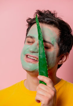 beautiful brunette man with aloe mask on his face