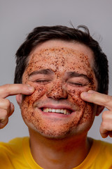 beautiful brunette man with coffee beans mask