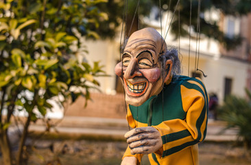 Old Man Puppet Runner in Tracksuit in Street
