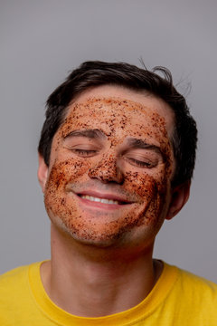 beautiful brunette man with coffee beans mask