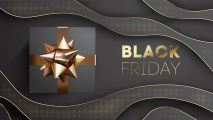 Black friday banner with black giftbox decorated with golden ribbon on black background.