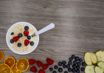 healthy muesli with oatmeal, blueberries, raspberries and dry fruits from above