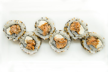 tuna uramaki on white background, salmon uramaki japanese food, top view, japanese food, sushi,  asian food, japanese cuisine, high-key studio shot, spicy salmon cream cheese sushi rolls