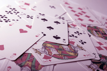 Play cards scattered on the table. - Powered by Adobe